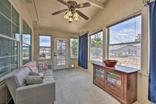 a living room with a couch and a ceiling fan at Arizona Room, Gas Grill Charming Payson Home! in Payson