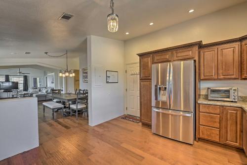 a kitchen with a refrigerator and a dining room at Arizona Room, Gas Grill Charming Payson Home! in Payson