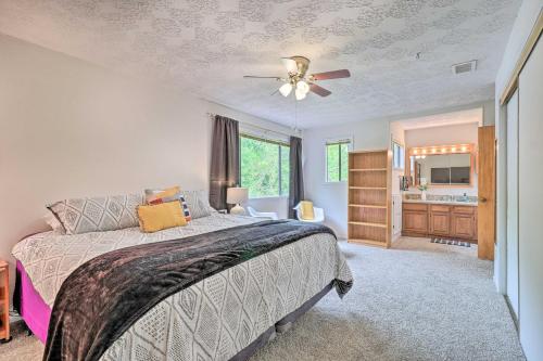 a bedroom with a bed and a ceiling fan at Bryan Home with Deck and Yard about 4 Mi to Texas A and M! in Bryan