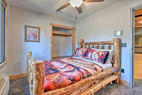 a bedroom with a wooden bed and a ceiling fan at Massive Hatfield Loon Lodge with Roller Rink in Hatfield