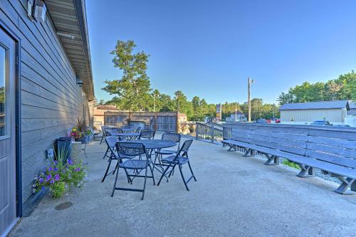 a group of tables and chairs on a patio at Massive Hatfield Loon Lodge with Roller Rink in Hatfield
