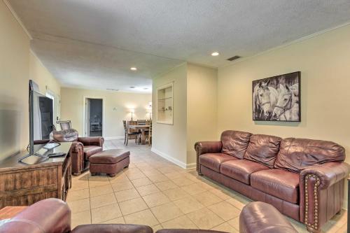 a living room with leather furniture and a flat screen tv at Pet-Friendly Home Close to WEC Ocala! in Ocala
