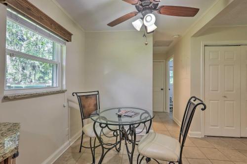 a dining room with a ceiling fan and a glass table at Pet-Friendly Home Close to WEC Ocala! in Ocala