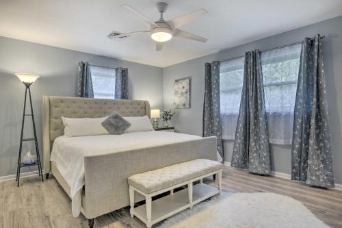 a bedroom with a bed and a ceiling fan at Updated High Point Retreat with Pool and Backyard in High Point