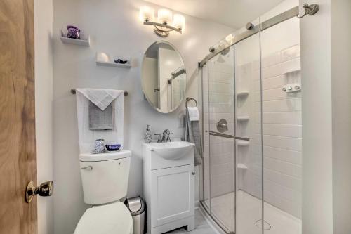 a bathroom with a toilet and a sink and a shower at Updated High Point Retreat with Pool and Backyard in High Point