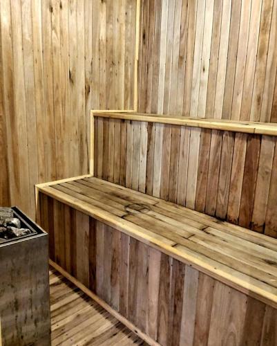a wooden sauna with wooden shelves in a room at Arena de Mar depto A in Mar de las Pampas