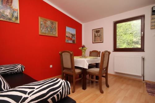 a dining room with a table and chairs at Apartments with WiFi Opric, Opatija - 7756 in Lovran