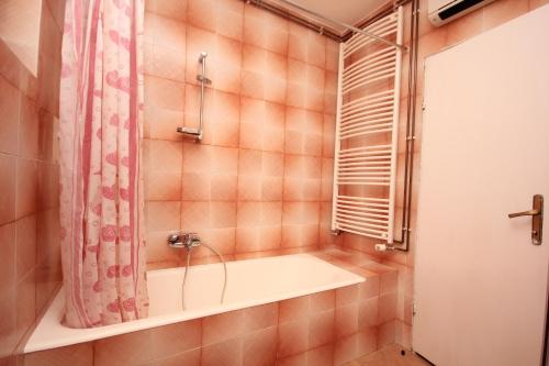 a bathroom with a tub and a shower at Apartments with WiFi Opric, Opatija - 7756 in Lovran