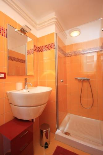 a bathroom with a sink and a shower at Apartments with parking space Lovran, Opatija - 7705 in Lovran