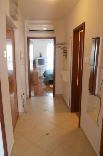 a hallway leading to a living room with a room at Apartments with WiFi Lovran, Opatija - 7886 in Lovran