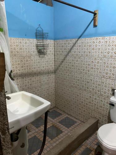 a bathroom with a sink and a toilet at Hostal Maria in Rivas