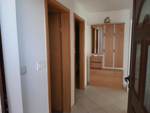 a hallway of a house with a door and a bathroom at Apartments with a parking space Mali Losinj (Losinj) - 8067 in Mali Lošinj