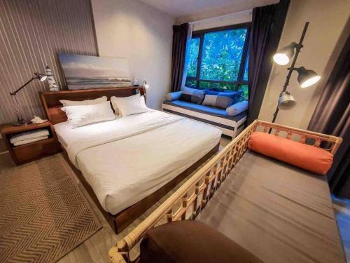 Postel nebo postele na pokoji v ubytování Rain Condo @ Cha Am-Huahin, Pool Access from room