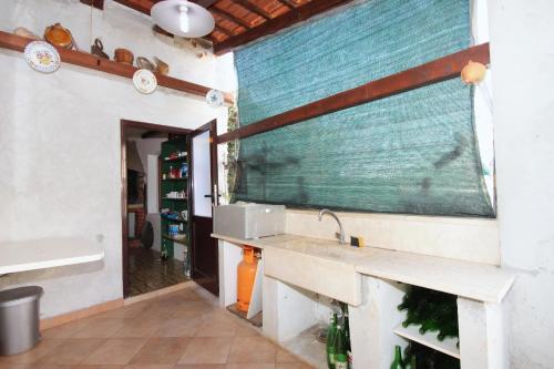 a kitchen with a sink and a counter top at Seaside holiday house Brna, Korcula - 9235 in Smokvica