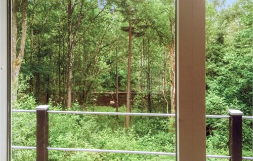 a window with a view of a forest at Knäred in Knäred