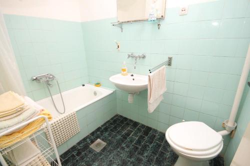 a bathroom with a sink and a toilet and a tub at Holiday house with a parking space Zrnovo, Korcula - 9213 in Korčula