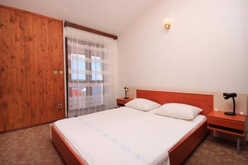 Postel nebo postele na pokoji v ubytování Apartment Prizba 9227c