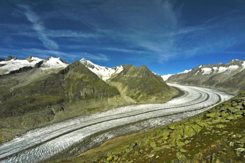 a winding mountain road in the mountains with snow at Chalet Trollius in Bettmeralp