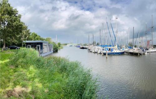 a group of boats are docked in a marina at Awesome Ship In Warns With Kitchen in Warns