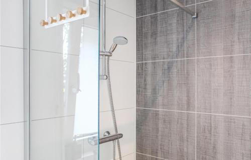 a shower in a bathroom with a glass door at Awesome Ship In Warns With Kitchen in Warns