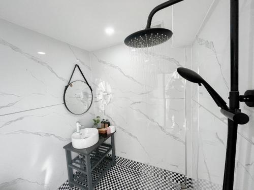 a bathroom with a sink and a mirror at LIM Homestay in Phan Thiet
