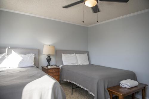 a bedroom with two beds and a ceiling fan at Stroll to Slopes, Village Area, Ski in-out MtLodge 269 in Snowshoe