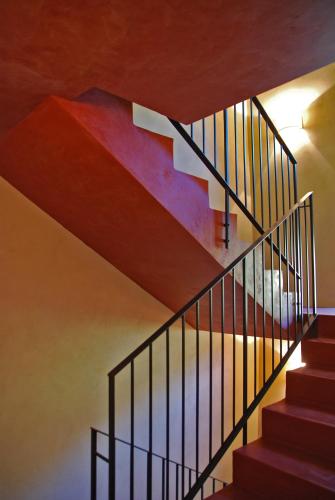 a spiral staircase in a house with colorful ceilings at Prati Palai in Bardolino