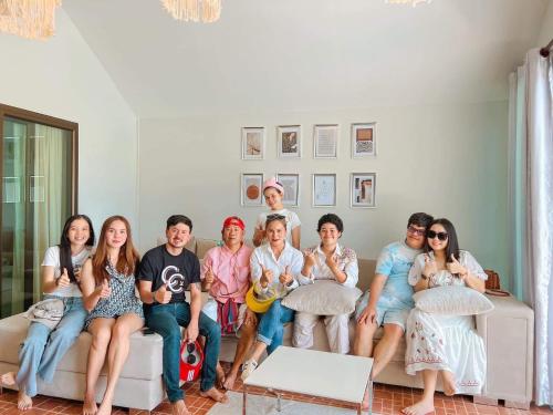 a group of people sitting on a couch at My home resort - ขนอม นครศรีธรรมราช in Khanom