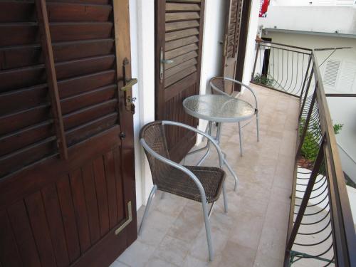 two chairs and a table on a balcony at Holiday Home Mona in Igrane