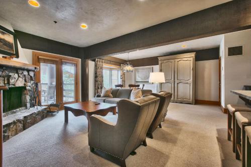 a living room with a couch and a table at Luxury Three Bedroom Suite with Mountain Views and Hot Tub apartment hotel in Park City