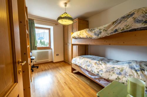 Postel nebo postele na pokoji v ubytování Casa Pergher