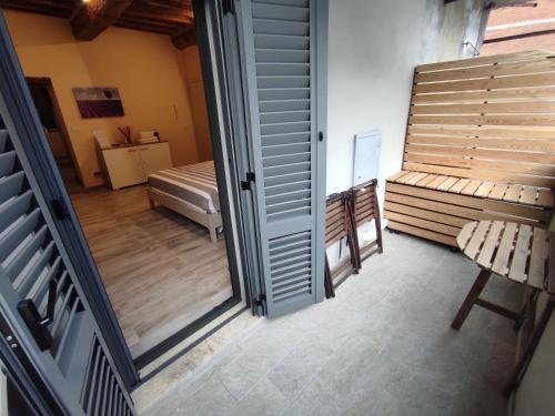 a view of a room with a bedroom and a door at The View - Sunset & Relax - Suite - Appartamenti Vista Lago in Passignano sul Trasimeno