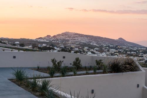 a view of a city from the roof of a house at Lavadoze Luxury Suites in Éxo Goniá