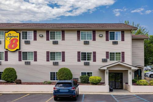 a car parked in a parking lot in front of a hotel at Super 8 by Wyndham Johnstown/Gloversville in Johnstown