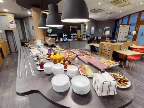 a long table with plates of food on it at Ibis Bratislava Centrum in Bratislava