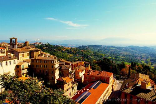 an aerial view of a city with buildings at Hotel Umbria in Perugia