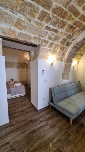 a living room with a couch and a bed at Bobboi in Cagliari