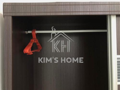 a sign on a window with a house on it at Kim’s Home - Homey At Your Stay in Nibung Tebal