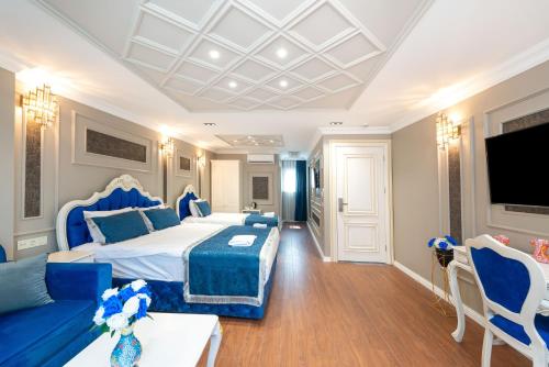 a hotel room with a bed and a couch at Begonville Mansion Oldcity in Istanbul