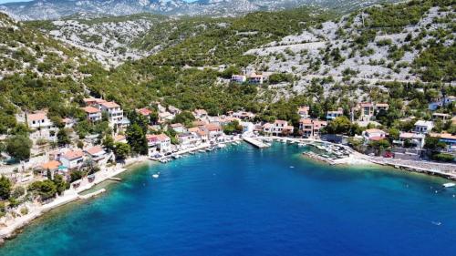 an aerial view of a town with blue water at Apartment Biondić in Starigrad