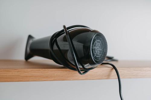 a black microphone sitting on top of a table at Maximilian Studios in Speyer