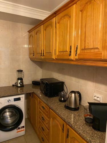 A cozinha ou kitchenette de The Palms Apartment