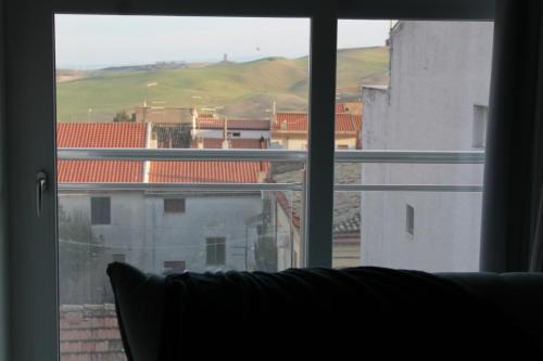 a view of a city from a window at Vista Normanna in Pietra Montecorvino