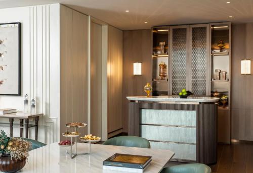 a kitchen and dining room with a table and chairs at Address Istanbul in Istanbul