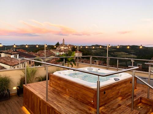 a hot tub on the balcony of a house at La Piazzetta degli Artisti - Boutique B&B in Bossolasco