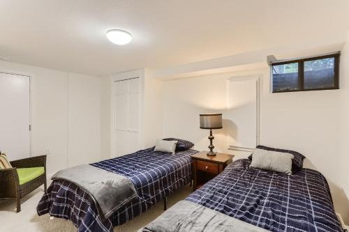 a bedroom with two beds and a window at 1815 Bluebell Ave in Boulder