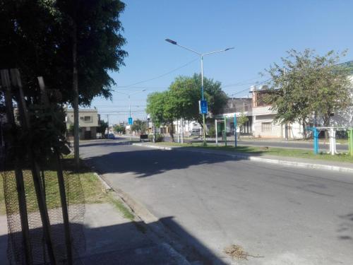 an empty street in a small town with trees at BAJOS de AMADOR in San Miguel de Tucumán