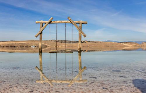 a metal frame in the middle of a body of water at Apartment Olivia in Šmrika
