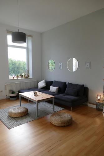 a living room with a couch and a table at Ferienhaus Erna in Doberlug-Kirchhain