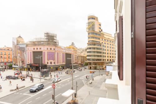 a view of a street in a city with buildings at Woohoo Rooms Boutique Gran Vía in Madrid